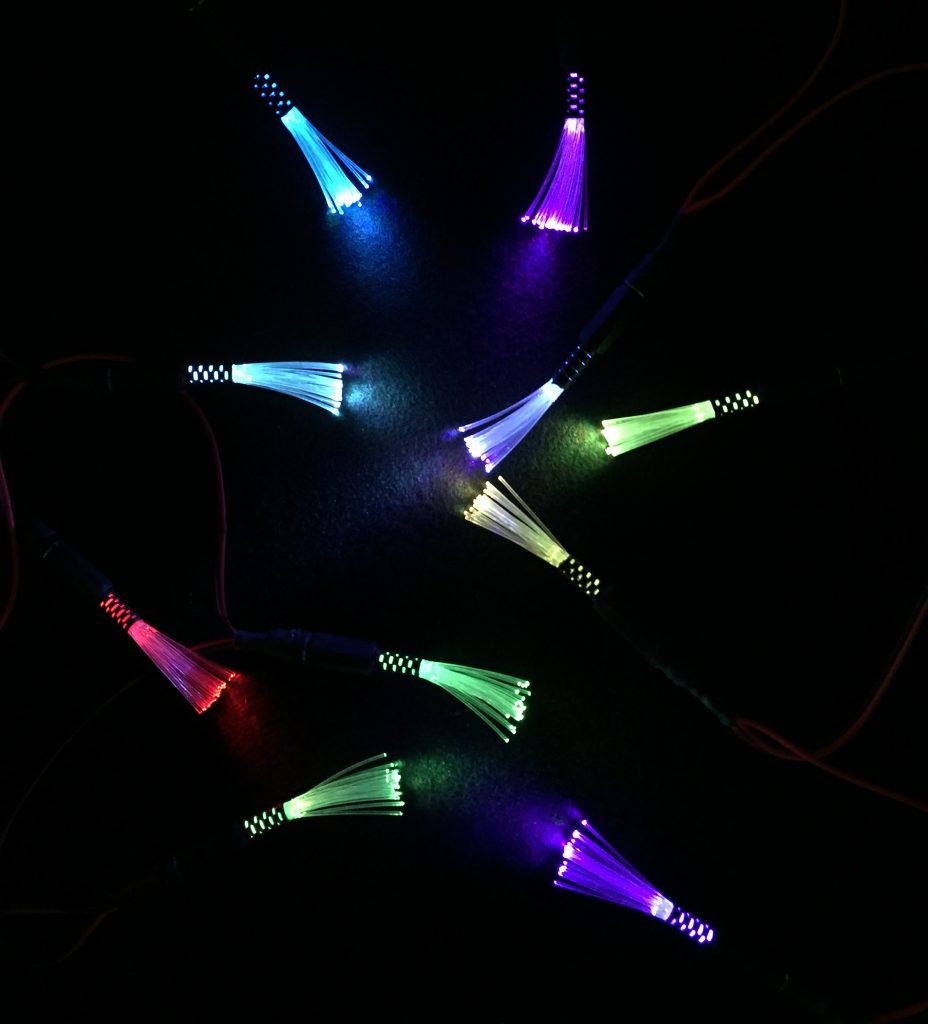 photo showing mini sparkles lit up in different stages of colour changing