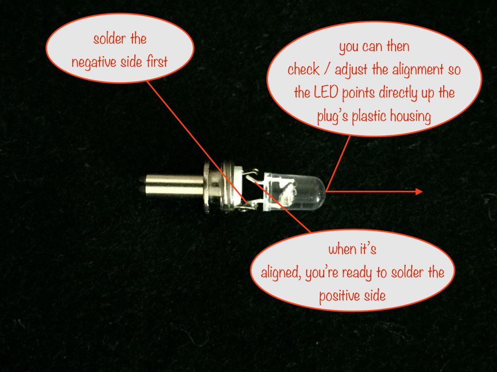 photo showing how to solder the negative (cathode) leg of the LED first to allow you to align the LED so it points directly up the plastic housing before soldering the second leg