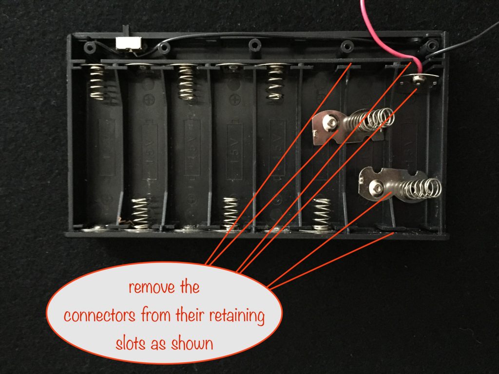 photo showing the connectors removed from their retaining slots
