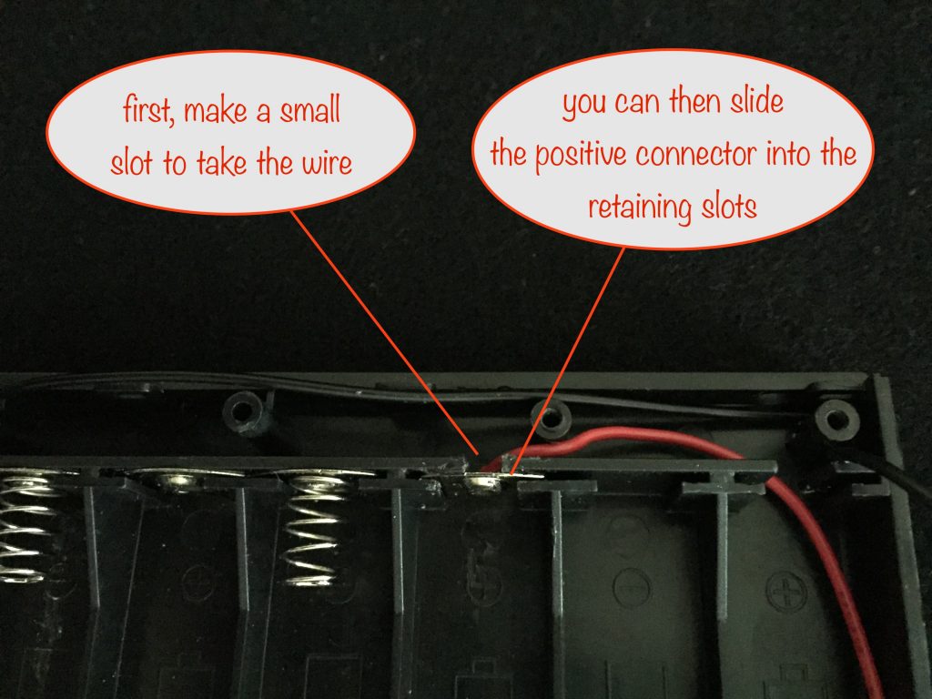 photo showing the slot for the wire and the positive connector slid into its new position