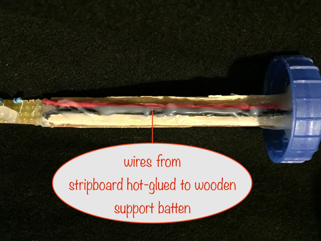 a photo showing the twin wires hot-glued to the wooden batten