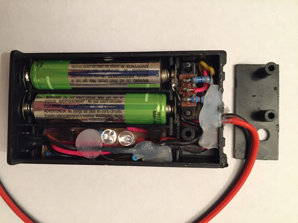photo of the completed project showing the circuit and switch mounted in the battery box