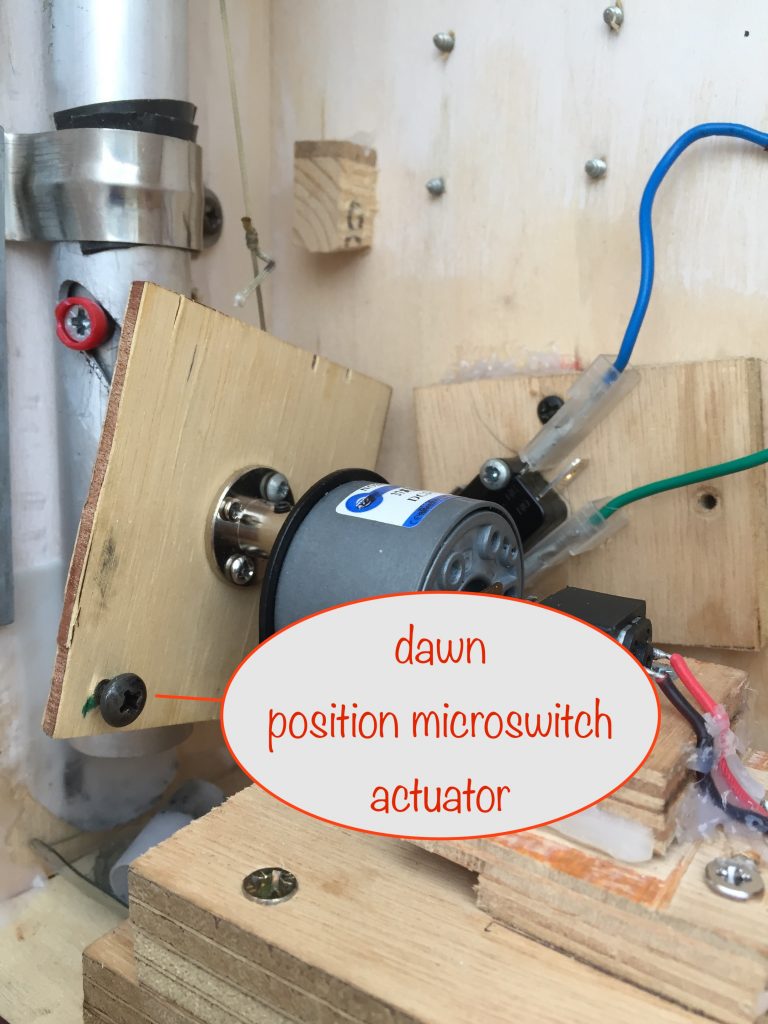 photo showing the screwhead that's used to actuate the microswitch when the solar panels have reached their dawn starting position